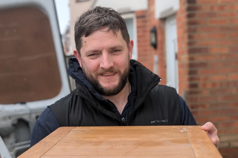Bournemouth removal team carrying furniture